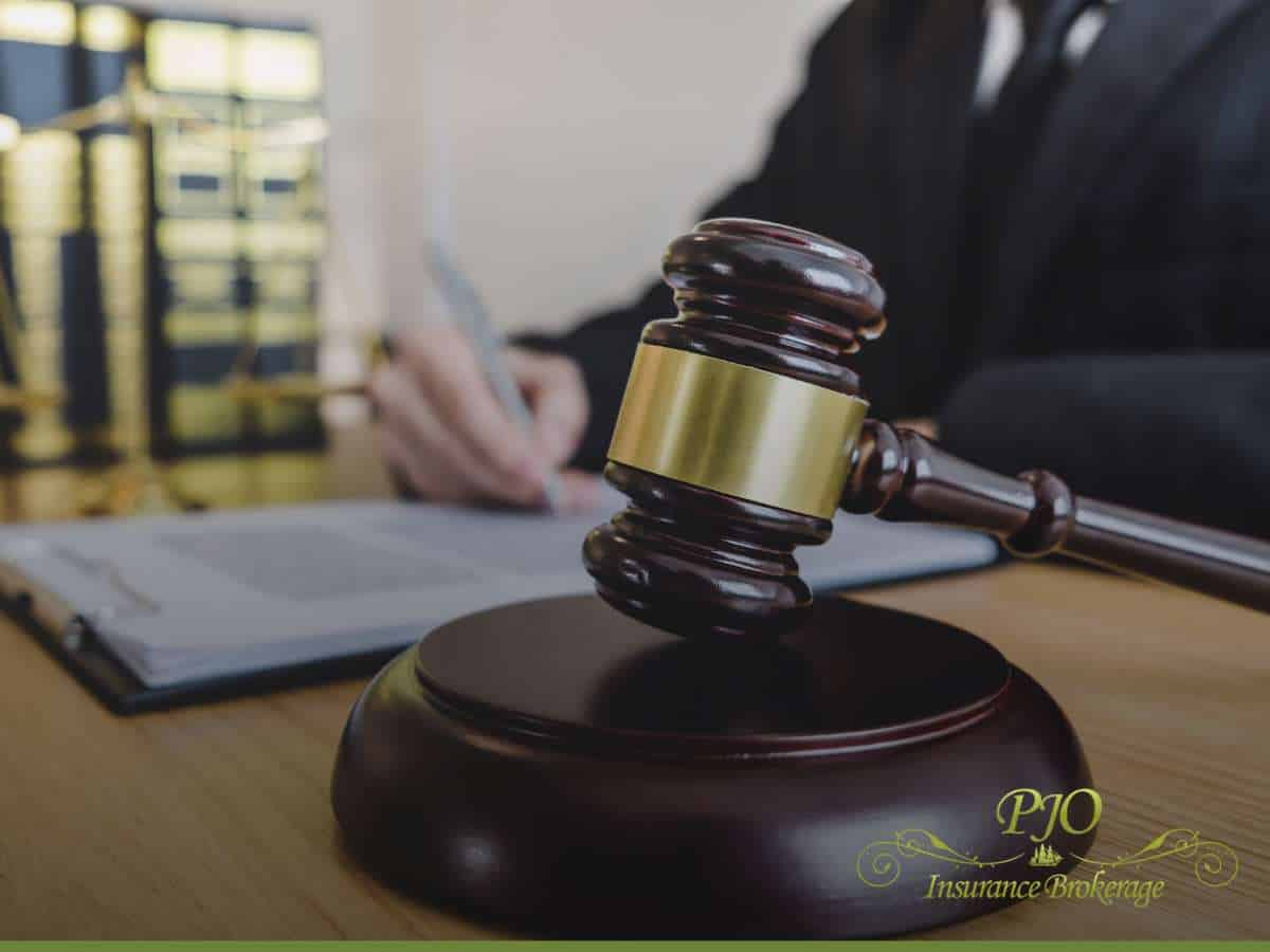 Judge's gavel on desk with paperwork, symbolizing a Workers' Compensation Claim process