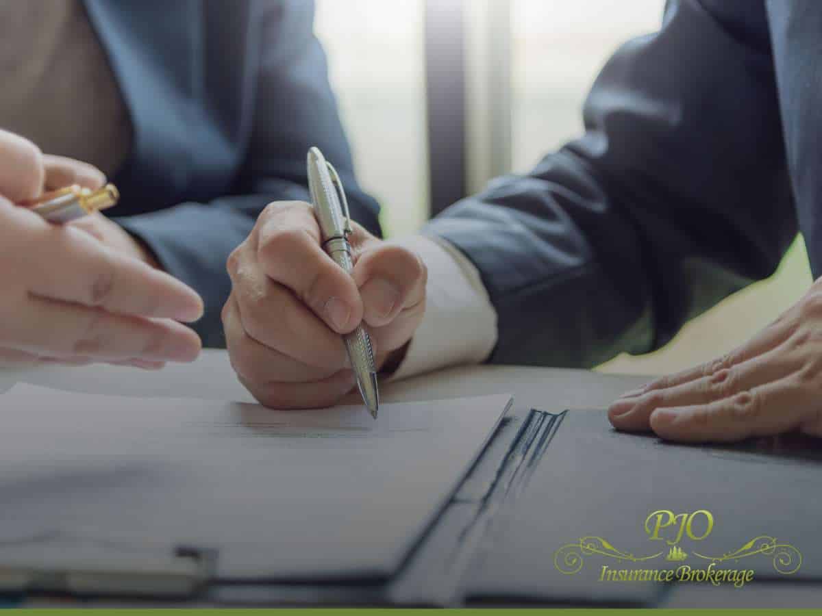 Signing daycare insurance documents at PJO Insurance Brokerage